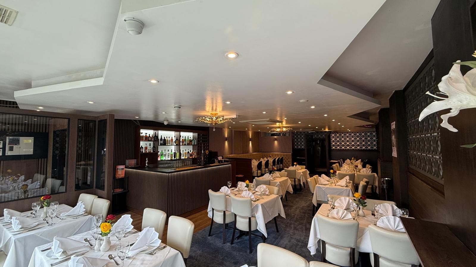 The Maidenhead Spice dining room — bar, chandeliers and warm amber light