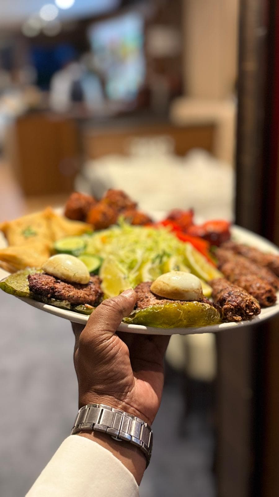 Seekh kebab with raita and shredded salad